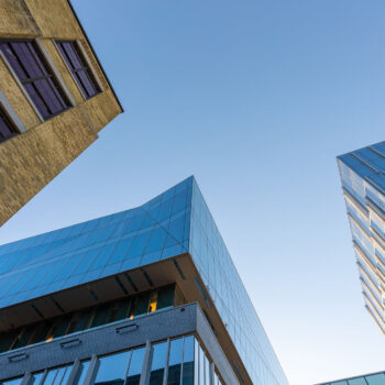 looking up at buildings and blue sky