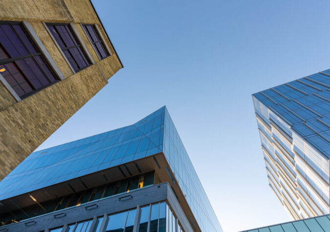 looking up at buildings and blue sky