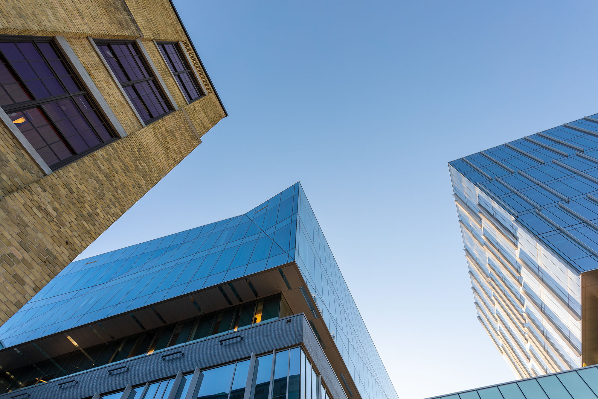 looking up at buildings and blue sky